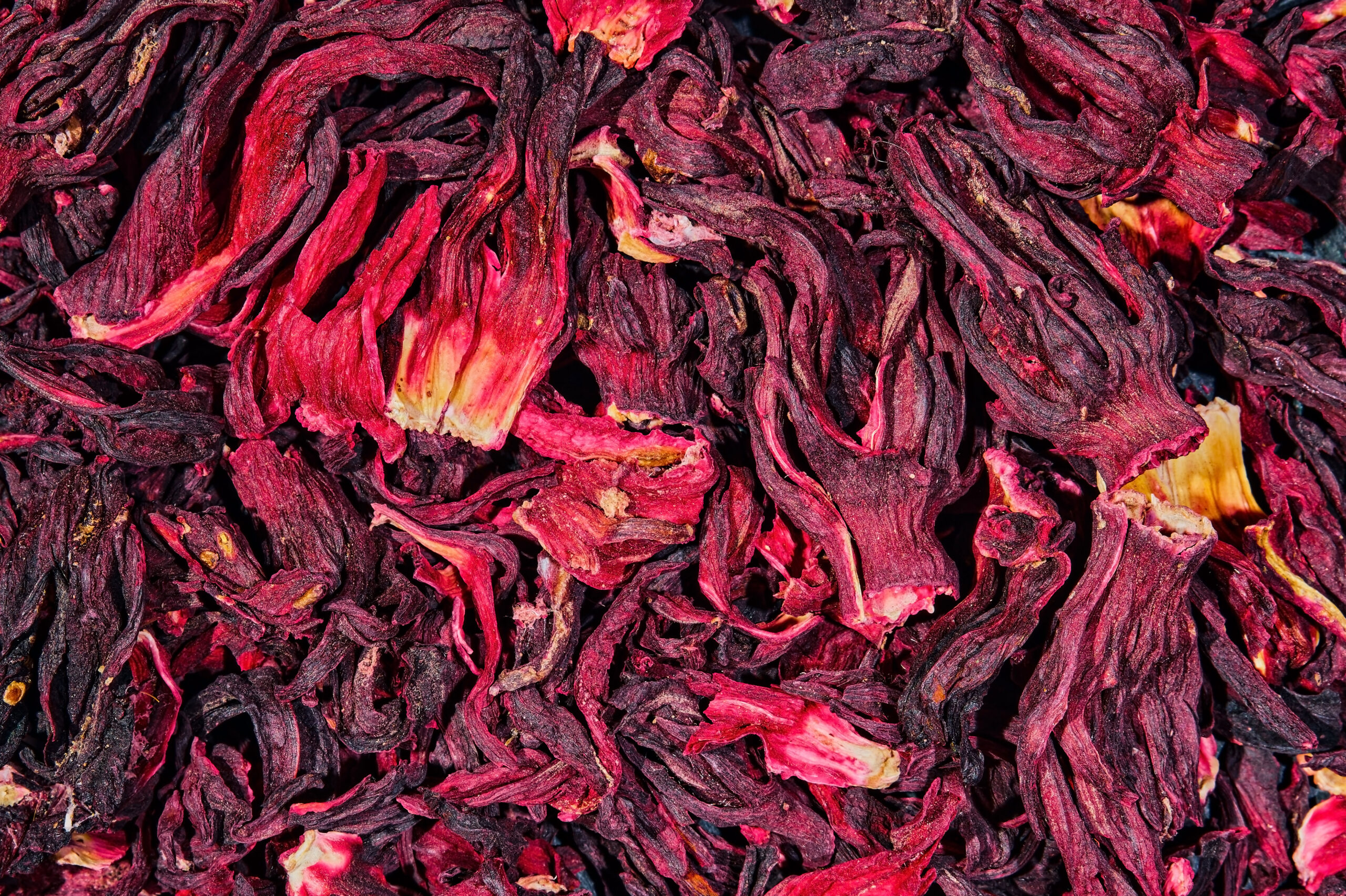 Heap of dry hibiscus tea. Background tea dried hibiscus flowers, top view